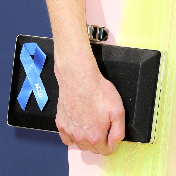 Alexis Bledel totes a Judith Leiber clutch with a blue ACLU ribbon to show support for the rights and civil liberties guaranteed by the Constitution to everyone in the United States