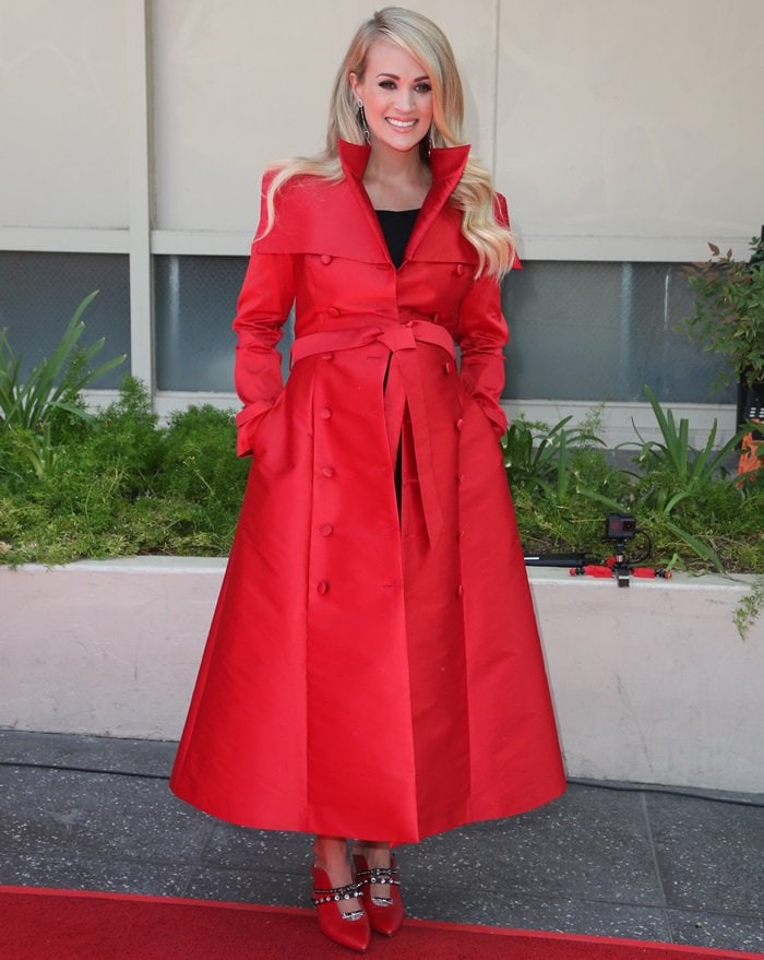 Carrie Underwood styled her coat with Maxine mules from Finnish shoe designer Minna Parikka
