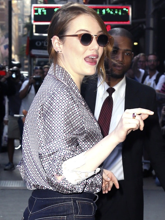 Emma Stone keeps it playful in a silky patterned pajama-style blouse from Fendi’s Resort ’19 Collection outside Good Morning America in New York City