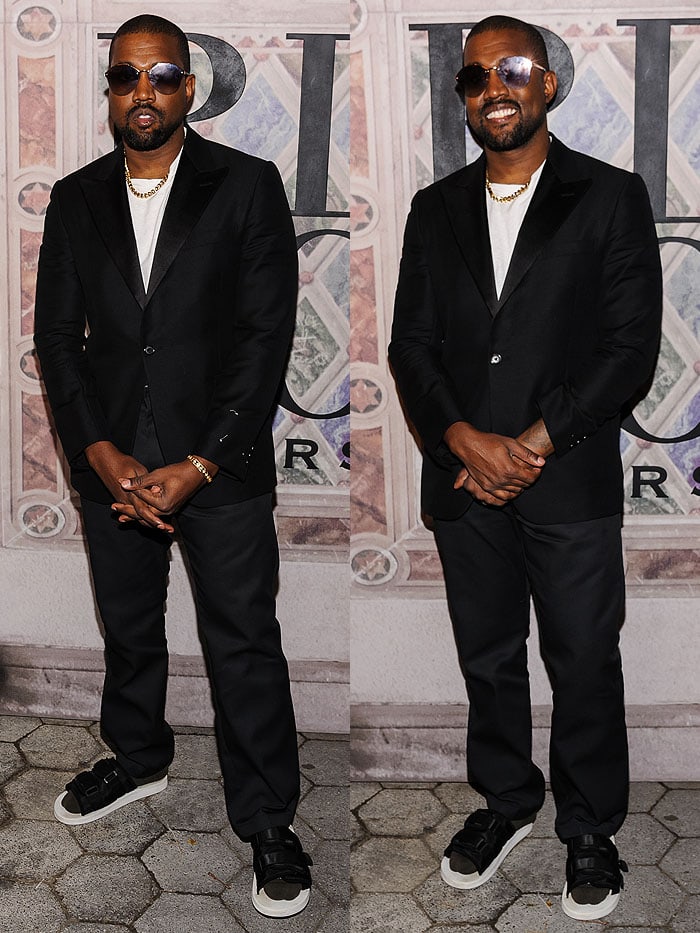 Kanye West wearing a suit with socks and sandals at the Ralph Lauren 50th Anniversary Event.