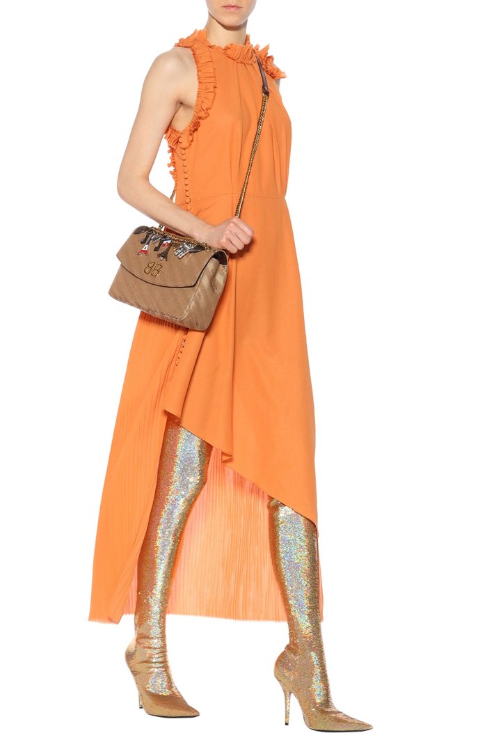 Crafted in Italy from stretch jersey, the style has a figure-hugging silhouette, while the pointed toe and covered stiletto heel enhance the seductive impression