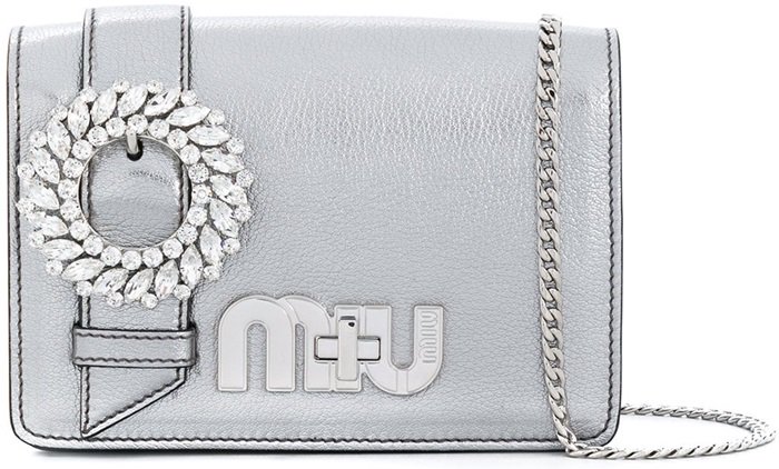This chrome leather My Miu shoulder bag features a foldover top with magnetic closure, a main internal compartment, a chain link fastening and crystal accents