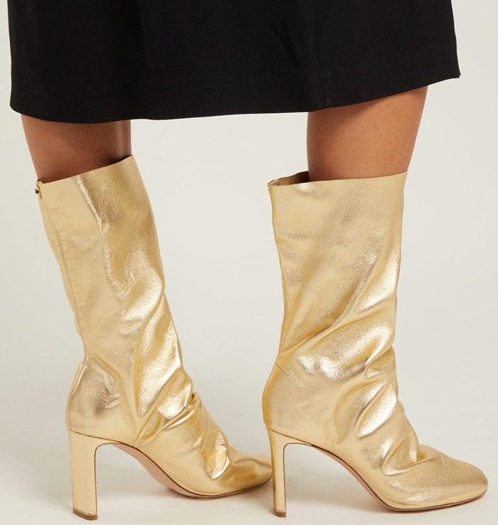 For AW18, Nicholas Kirkwood introduces a straight version of his signature curved heel, in the form of these gold D'Arcy leather boots