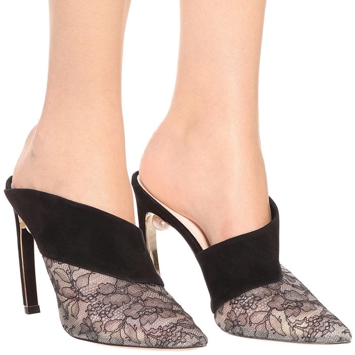 Made in Italy, this style features a pointed toe, a curved high heel and the telltale pearl embellishment at the junction of the heel for instant recognition