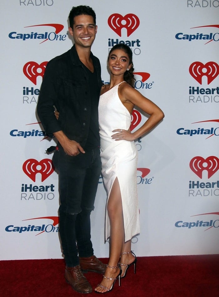 Sarah Hyland and her boyfriend Wells Adams in the press room at the 2018 iHeartRadio Music Festival at the T-Mobile Arena in Las Vegas on September 21, 2018
