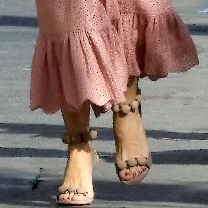 Close-up of Sofia Vergara’s Alaïa ‘Bombe’ beige suede ankle-strap sandals with round stud detailing