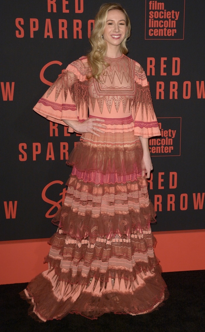 Dancer Isabella Boylston, known as Benjamin Millepied's former partner, poses in a unique Valentino Spring 2017 tiered dress featuring various shades of pink and brown with intricate details at the premiere of Red Sparrow at Lincoln Center