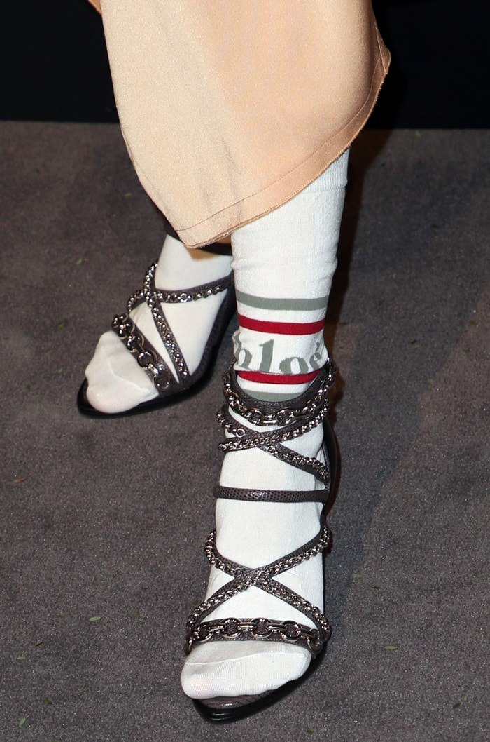 Debby Ryan rocks white logo socks by Chloé