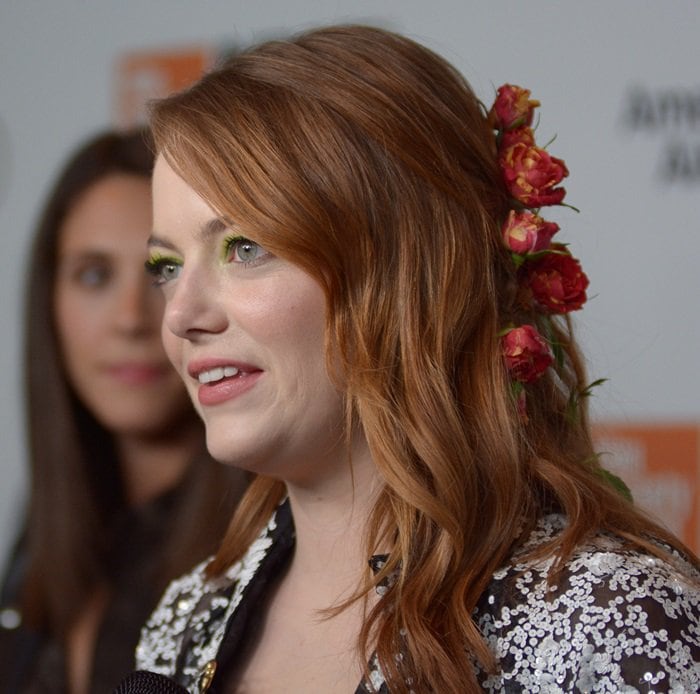 Emma Stone with beautiful roses intertwined into her hair