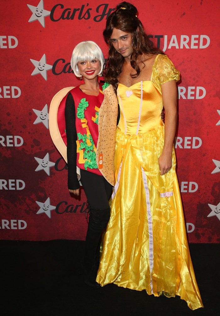 Sarah Hyland dressed as a taco and Wells Adams as Beauty the Beast‘s Belle, making them Taco Bell