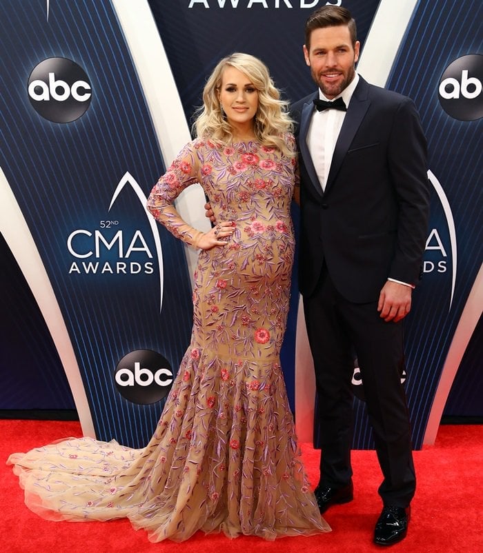 Carrie Underwood and Mike Fisher on the red carpet at the 2018 CMA Awards