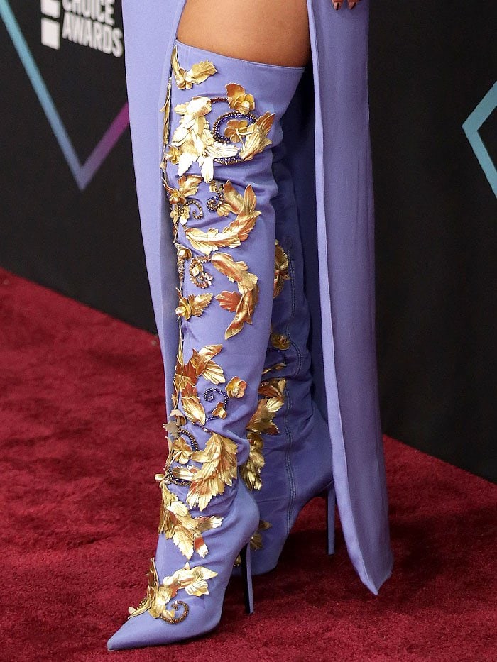 Details of the gold, embossed-leather baroque leaves and hand-embroidered crystals on Rita Ora's Atelier Versace thigh-high boots