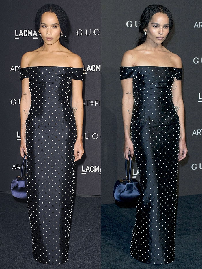 Zoë Kravitz wearing a Gabriela Hearst Spring 2019 pearl-embellished navy-satin off-shoulder dress accessorized with a matching Gabriela Hearst 'Demi' bag