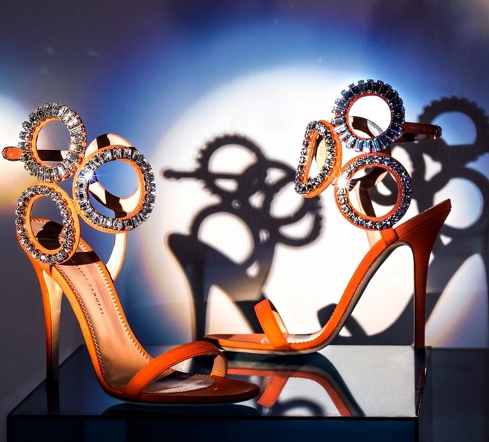 Rhinestone encrusted circular rhinestone accents at the ankle with adjustable buckle closure