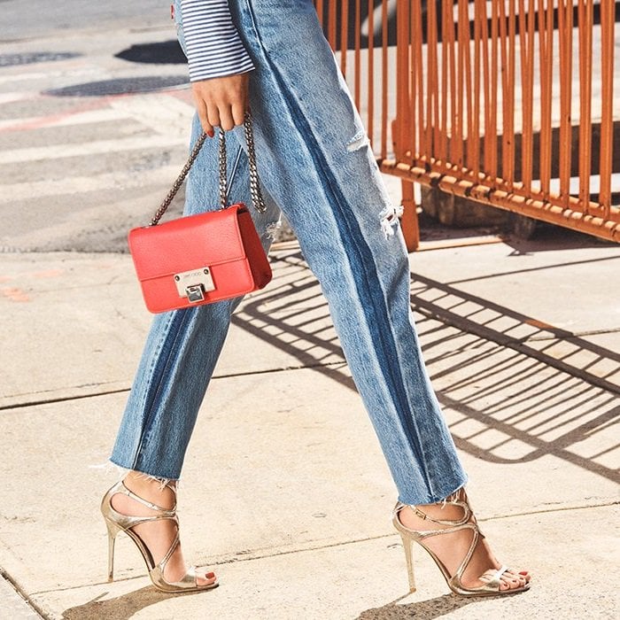 The delicate, sculptural straps wrap the foot securely from heel to toe, combining elegant support with the barely-there allure that defines the Jimmy Choo “Lance” sandal