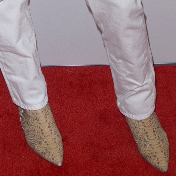 A closer look at Katie Holmes’ python-print ankle boots, which added an exotic texture and modern edge to her minimalist black-and-white outfit