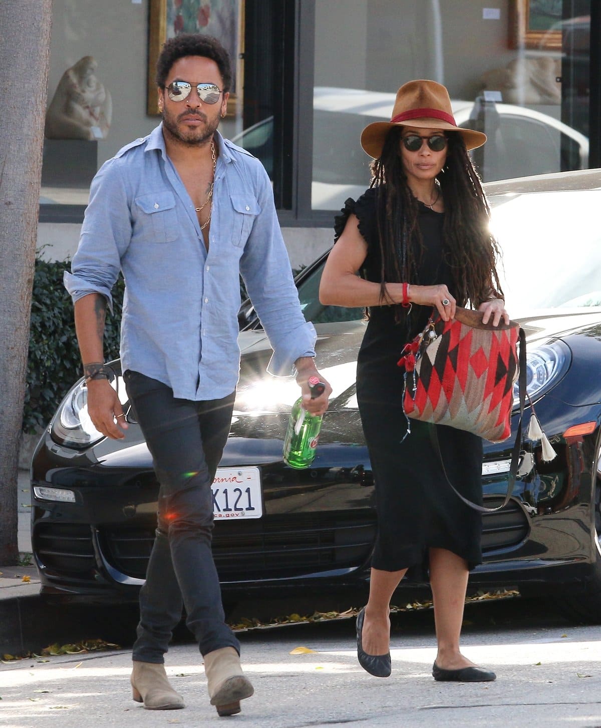 Lenny Kravitz and ex-wife Lisa Bonet step out for lunch at Gracias Madre in Beverly Hills on March 13, 2015, with Bonet pairing a chic black midi dress and ballet flats with a wide-brim hat, while Kravitz sports suede boots and his signature laid-back rock style