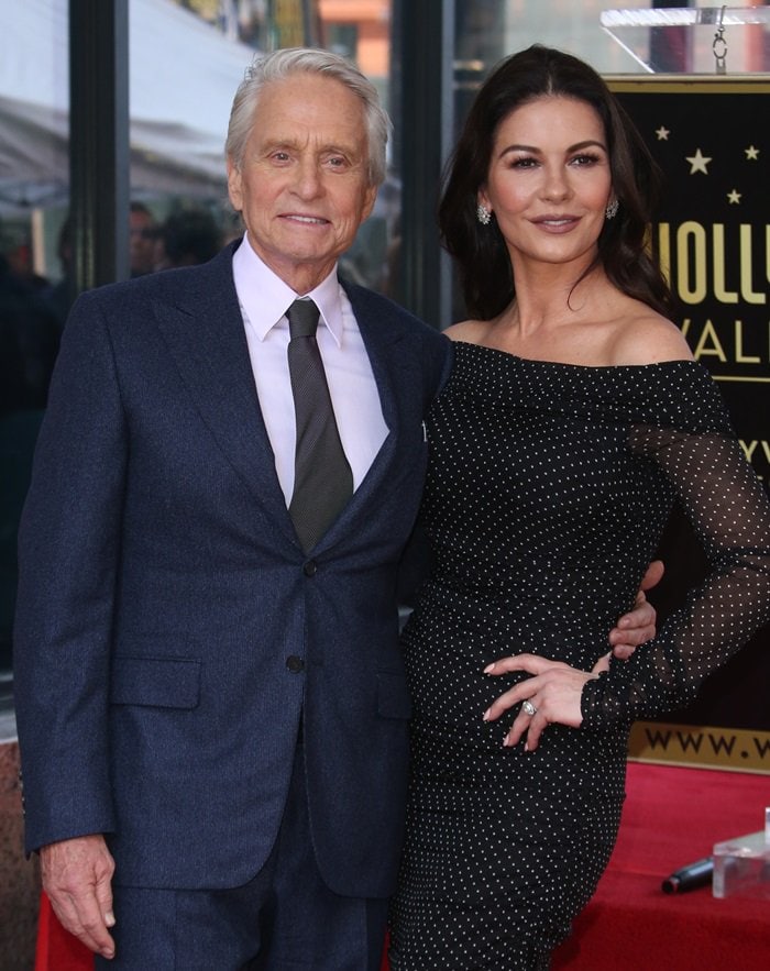 Michael Douglas posing with Catherine Zeta-Jones on the Hollywood Walk of Fame in Hollywood, California, on November 6, 2018