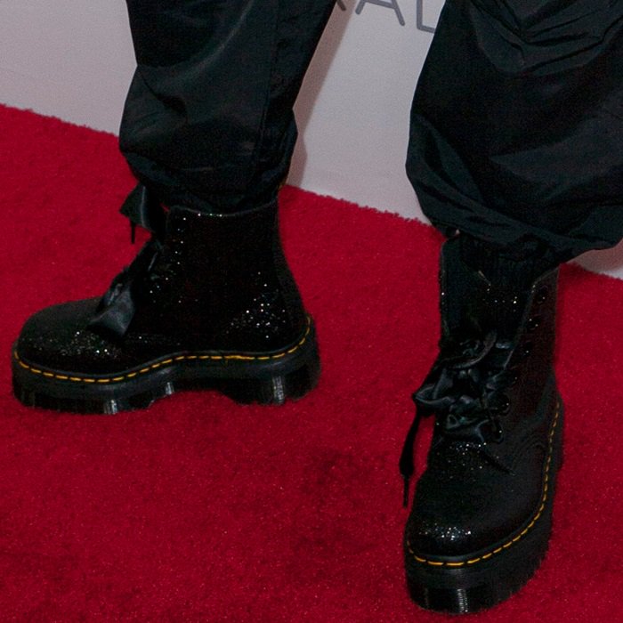 A closer look at Madison Beer’s glitter-coated Dr. Martens Molly platform boots, complete with oversized eyelets and satin ribbon laces