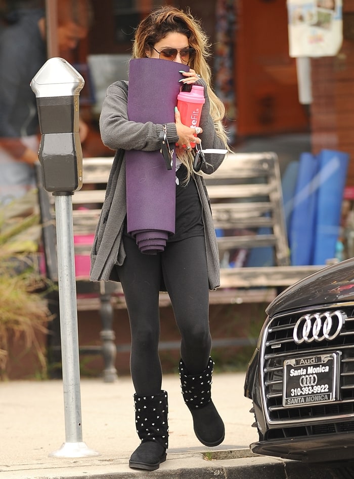Vanessa Hudgens stays relaxed post-yoga in black yoga pants and studded Koolaburra x Lauren Moshi “Lips” Ugg boots while leaving a session in Studio City on June 7, 2014