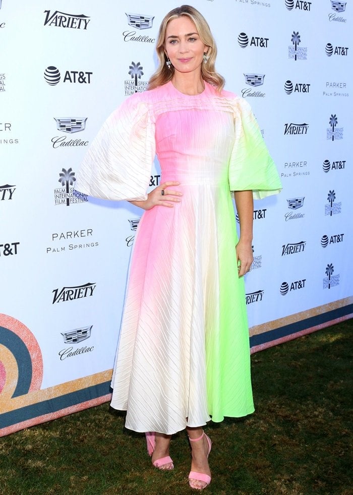 Emily Blunt's lovely Roksanda Pre-Fall 2019 dress boasted a delightful ombre effect, playfully adorned with shades of neon pink and green, which she paired effortlessly with soft pink Brian Atwood Crawford sandals featuring sleek, minimalist straps that enhanced the dreamy aesthetic of her look