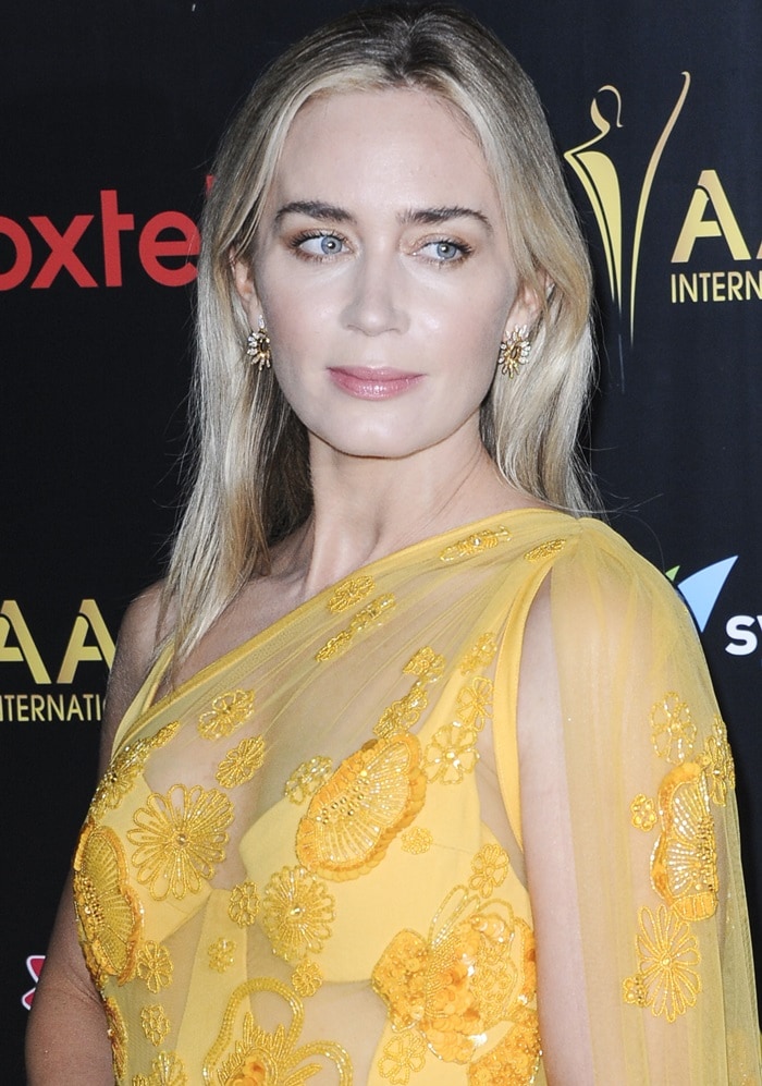 Emily Blunt shows off her earrings by Graziela Gems