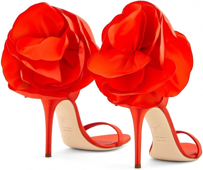 These sandals are made from red satin and are set on a stiletto heel and fasten with an ankle strap