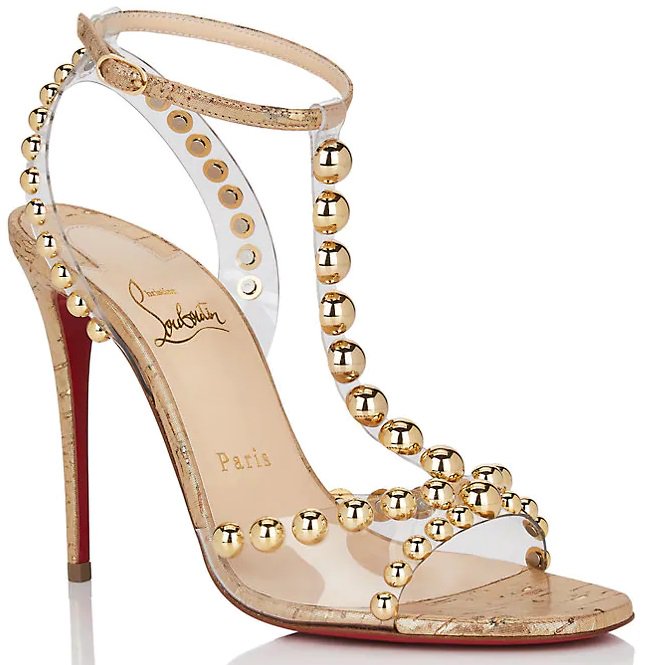 Styled with a leg-lengthening stiletto heel, these sandals are constructed in Italy of gold metallic cork and clear PVC