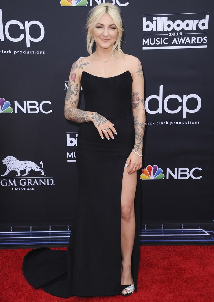 Julia Michaels pairs her sleek black strapless Paolo Sebastian gown with crystal-embellished suede slingback sandals by Giuseppe Zanotti, adding a refined sparkle to her minimalist red-carpet look at the 2019 Billboard Music Awards
