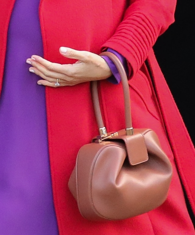 Meghan Duchess of Sussex, Meghan Markle, totes a cognac bag by Gabriela Hearst