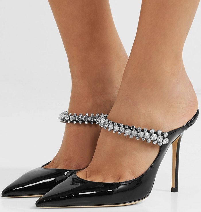 They're made in Italy with a high stiletto heel and a point toe, then set with a curved arch strap that is frosted with faceted crystals