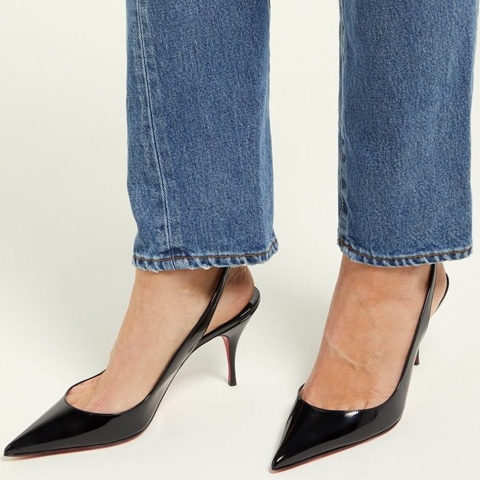 A classic black patent version of the Clare Sling elevates denim with its sharp silhouette and mid-heel design