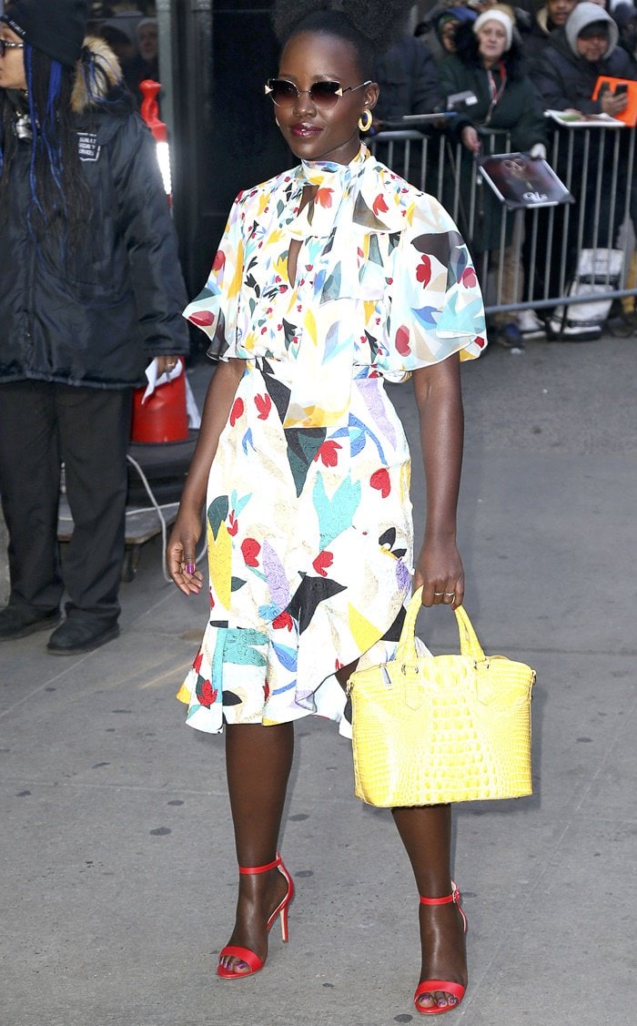 Lupita Nyong’o paraded her legs in a ruffled printed midi skirt and a matching pussy bow silk blouse from Prabal Gurung’s Pre-Fall 2019 collection