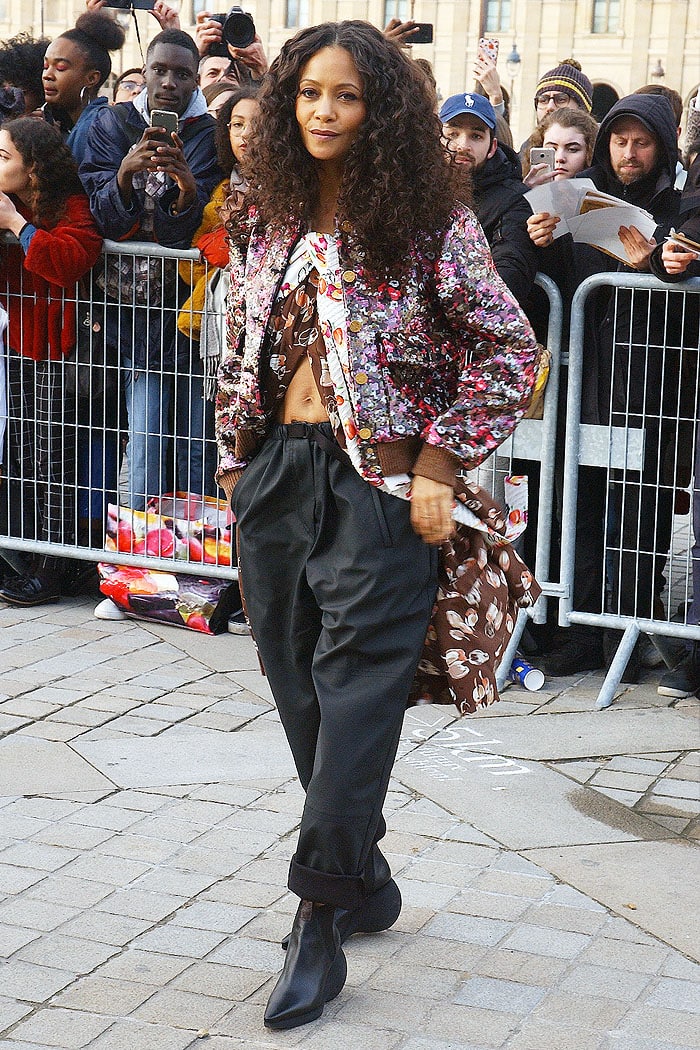 Thandiwe Newton rocking curly hair and a belly-baring outfit for the Louis Vuitton Fall 2019 fashion show