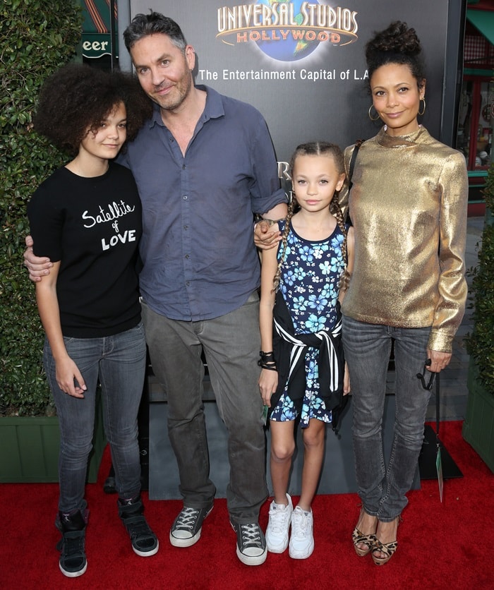 A young Nico Parker steps out with sister Ripley and parents Ol Parker and Thandiwe Newton for a family appearance at Universal Studios Hollywood