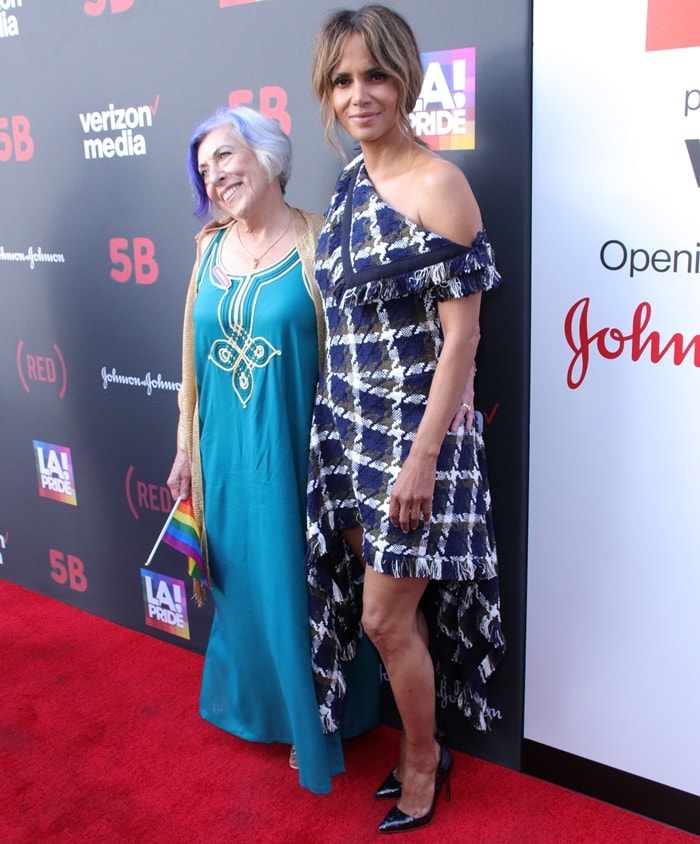 Nurse Alison Moed, who worked at the world’s first AIDS ward, joins Halle Berry at the U.S. premiere of 5B during LA Pride, where Berry grounded her asymmetrical dress with sleek black pointed-toe pumps