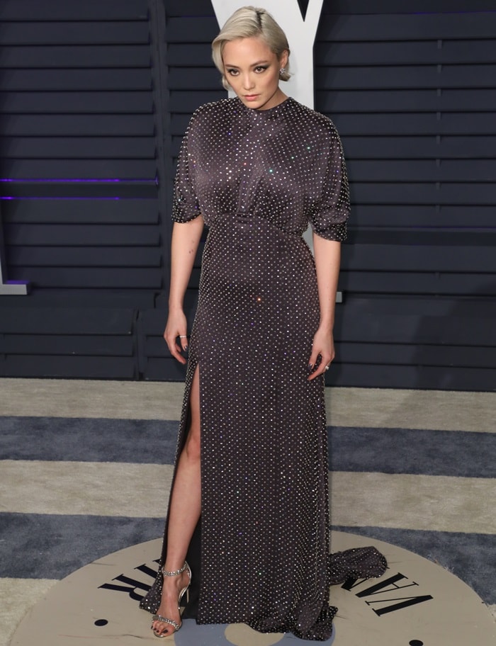 Pom Klementieff pairs her Prada dress with the same Jimmy Choo Shiloh sandals at the 2019 Vanity Fair Oscar Party