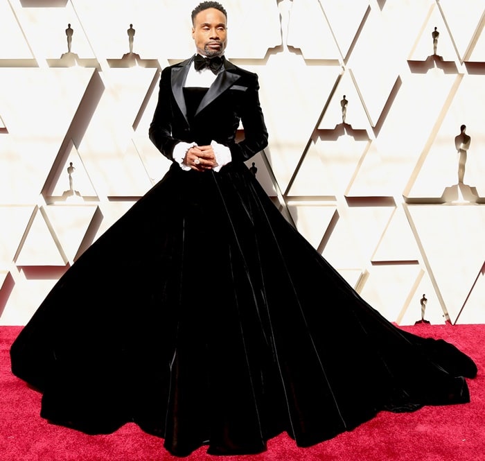 Billy Porter redefines black-tie dressing at the Oscars in a dramatic velvet Christian Siriano tuxedo gown that merges classic tailoring with sweeping red-carpet elegance