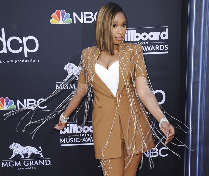 Jennifer Hudson's blazer dress features a crystal-embellished netting overlay with fringed hem