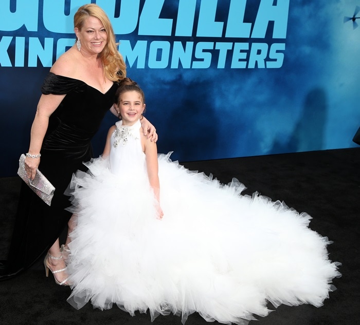 Lexi Rabe poses with her mother, Jessica S. Rabe, in a voluminous white Isabella Couture gown at the Godzilla: King of the Monsters premiere at the TCL Chinese Theatre on May 18, 2019