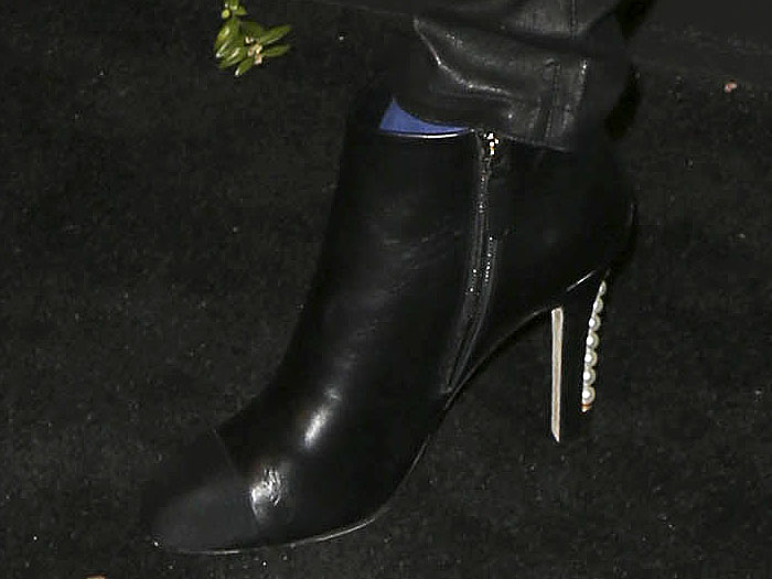 Details of Cara Delevingne's Chanel pearl-heeled cap-toe booties