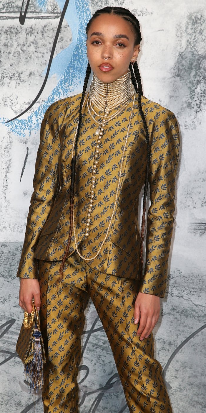 FKA Twigs in a gold and navy Christian Dior by John Galliano Fall 1997 jacquard suit and pearl choker