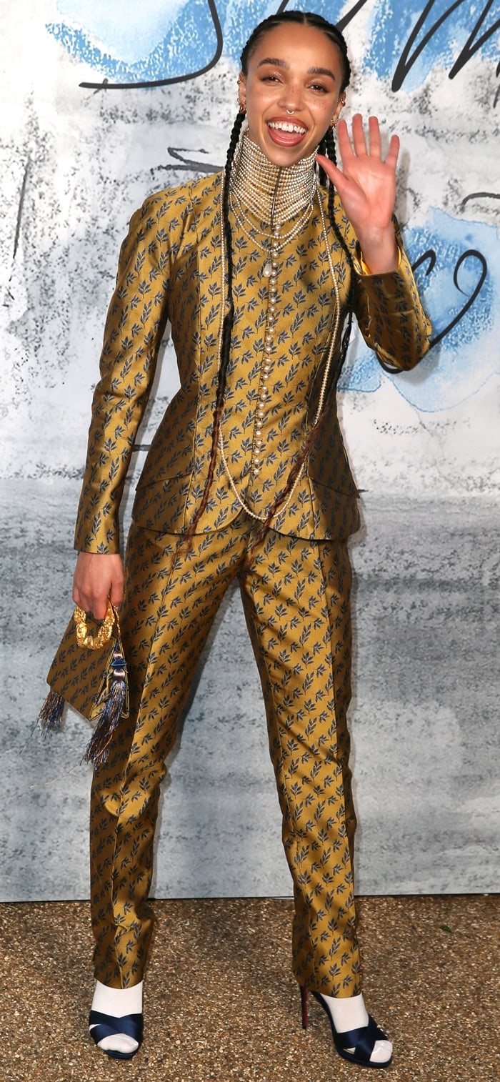 FKA Twigs wears a vintage Christian Dior by John Galliano Fall 1997 suit with white socks and navy sandals