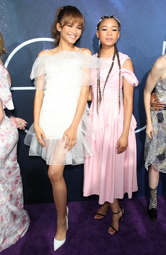 Zendaya posed alongside her co-star Storm Reid, dazzling in a white ruffled Nina Ricci dress and Le Silla pumps, while Storm stunned in a pink Simone Rocha gown with Jimmy Choo sandals