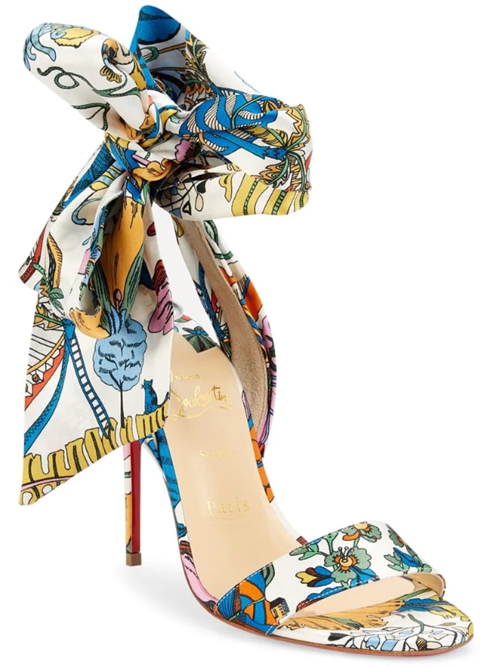 Bold printed pumps flaunt an oversized bow tie accent crafted of rich silk