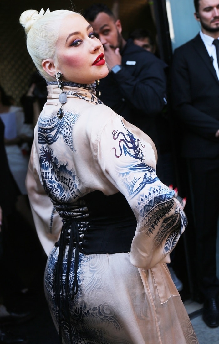 Rear view of Christina Aguilera's tattoo-print Jean Paul Gaultier kimono and lace-up black corset belt
