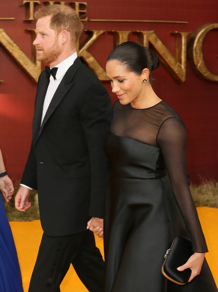 Meghan Markle wears a black Jason Wu mesh-panel dress with Aquazzura Portrait of a Lady slingback pumps