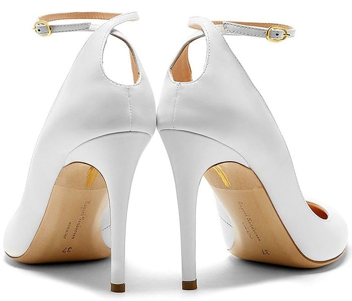 Back view of white Rupert Sanderson Balance pumps with raised heel panels and ankle straps