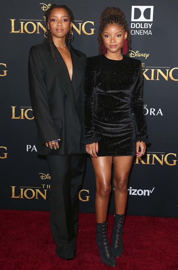 Chloe Bailey paired an oversized black pantsuit with peep-toe heels, while Halle Bailey contrasted the look in a glittering mini dress and Giuseppe Zanotti Janice mesh ankle boots