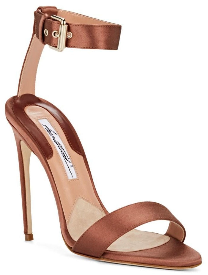 Brian Atwood's "Babe" sandals balanced delicate satin straps with towering stiletto heels, their warm bronze finish adding a subtle metallic glow beneath Bella Hadid's dramatic red Roberto Cavalli gown